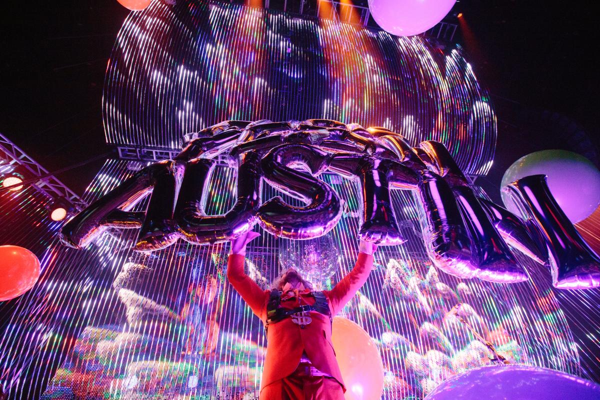 Flaming Lips at ACL Live under neon pink lights and silver helium balloons that spell out AUSTIN.