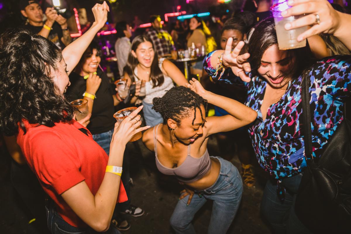 Group of people dancing at Mala Vida during Hot Summer Nights.