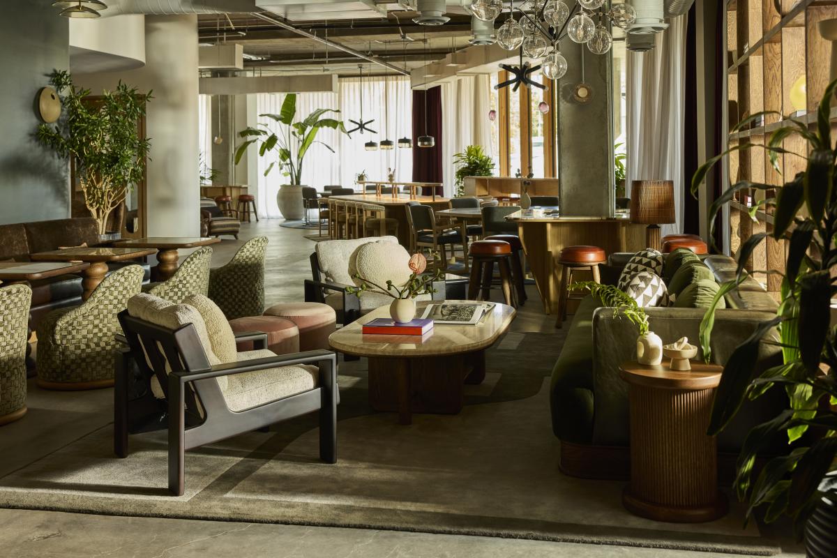 Event space at The Malin fully set up with chairs, coffee table and house plants.