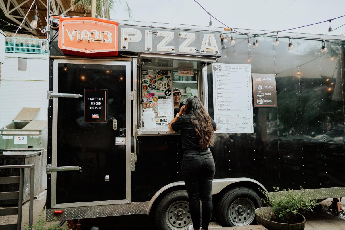 Image of a women ordering at the Via 313 food truck.