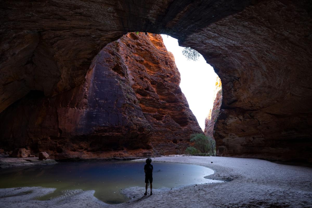 A man standing in Cathedral Gorge, Bungle Bungle Range