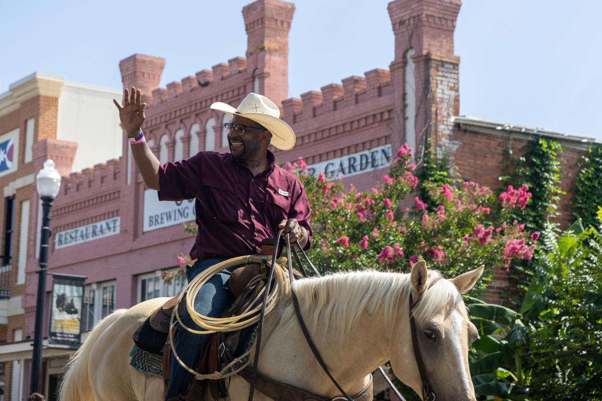 African American Cowboy riding a horse during the Bastrop Homecoming and Rodeo Parade