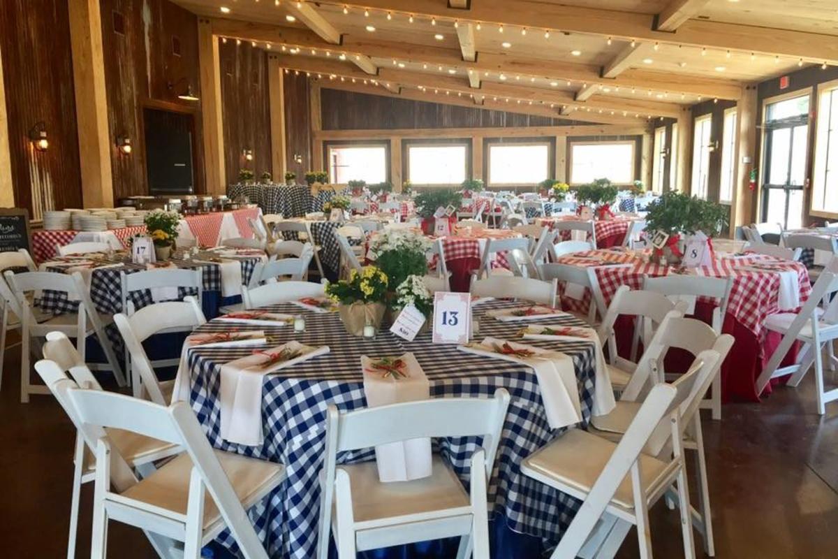 Amelia Farm and Market Eating Area With Round Tables And Checkered Table Cloths