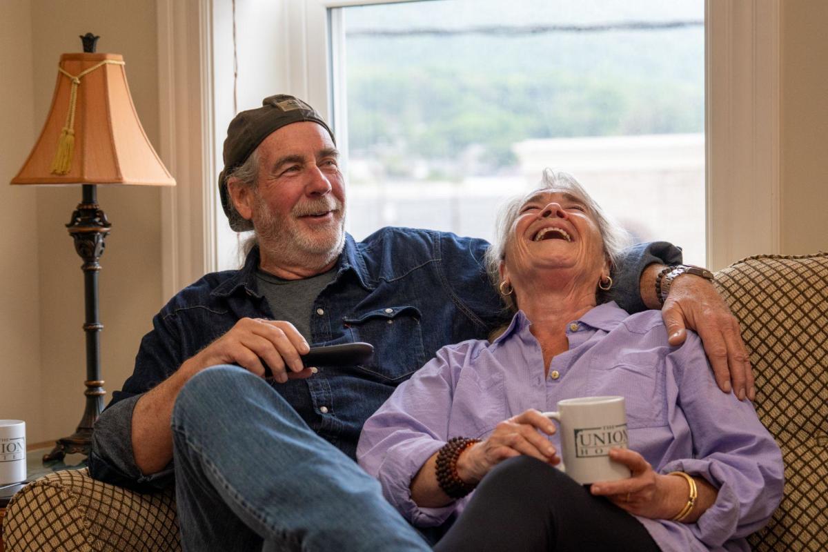 Elder couple laughing