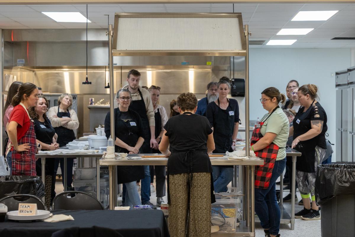 People cooking at a cooking class by The Food School