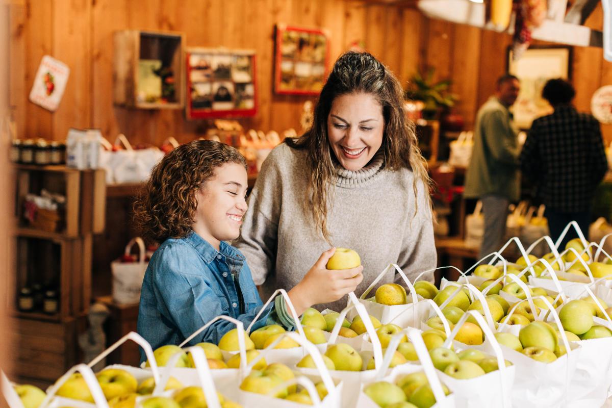 A mother and son looking at apples at Jackson's Orchard.
