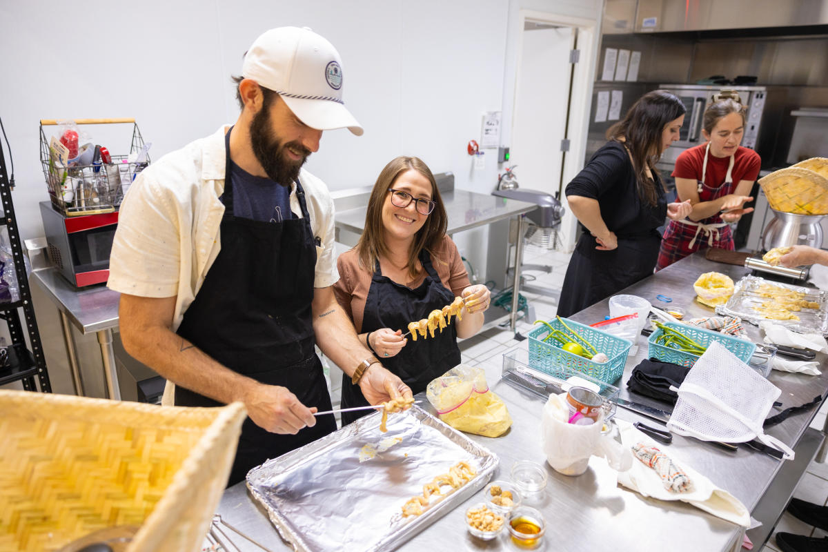 Two people cooking food