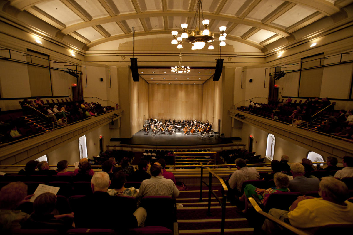 An image of the interior of Vanmeter Hall located on Western Kentucky University in Bowling Green, a classical music concert is going on.