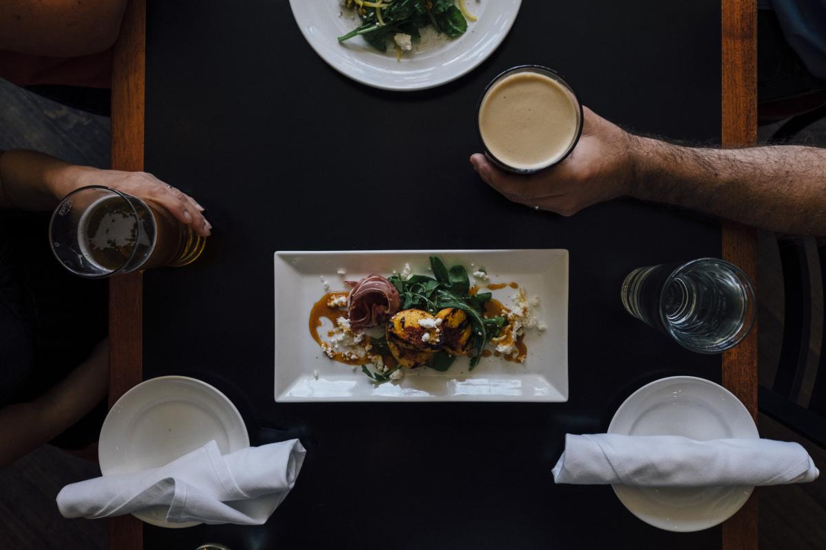 A delicious display of food and refreshing drinks at an acclaimed restaurant in Boulder.