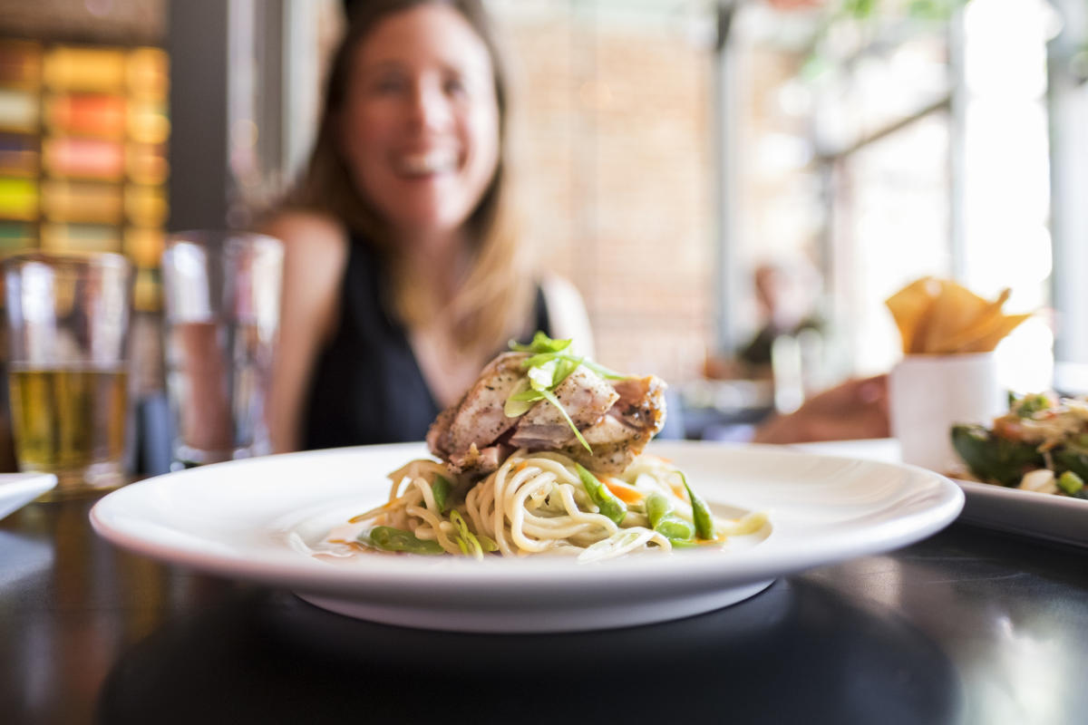 Woman Smiling with Meal