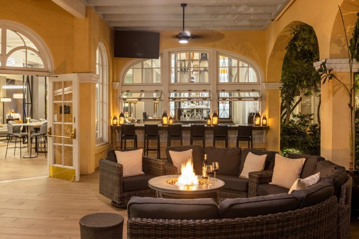 Crowne Plaza patio at night with fire pit on.