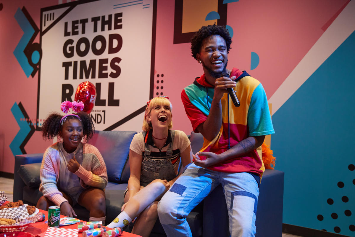 private karaoke room at Chandler's Round1 Bowling & Arcade with three people singing