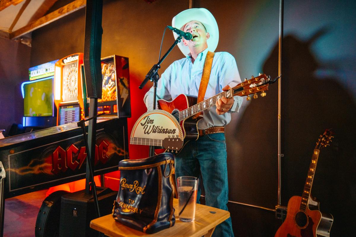 Jim Wilkinson playing a guitar