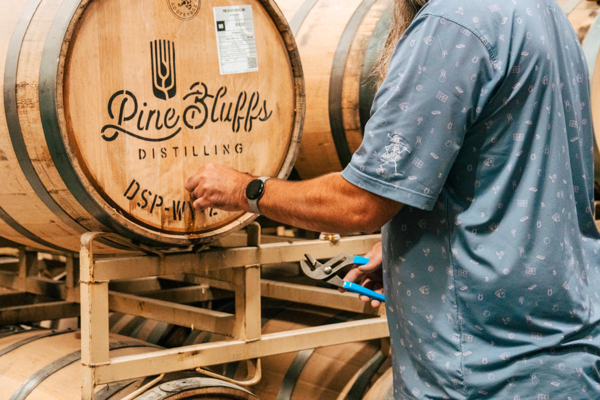 Man pouring from a barrel