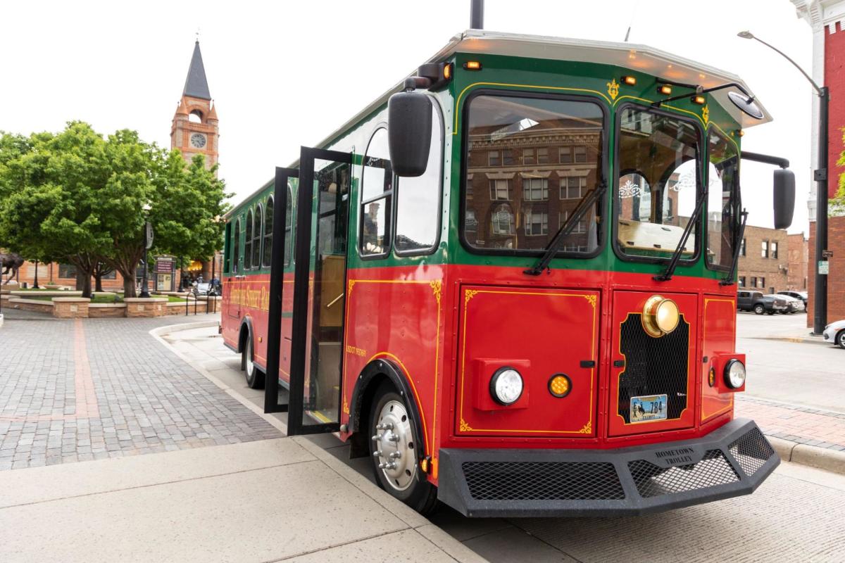 The Cheyenne Street Railway Trolley parked in downtown Cheyenne, offering historical tours as one of the top things to do in the area.