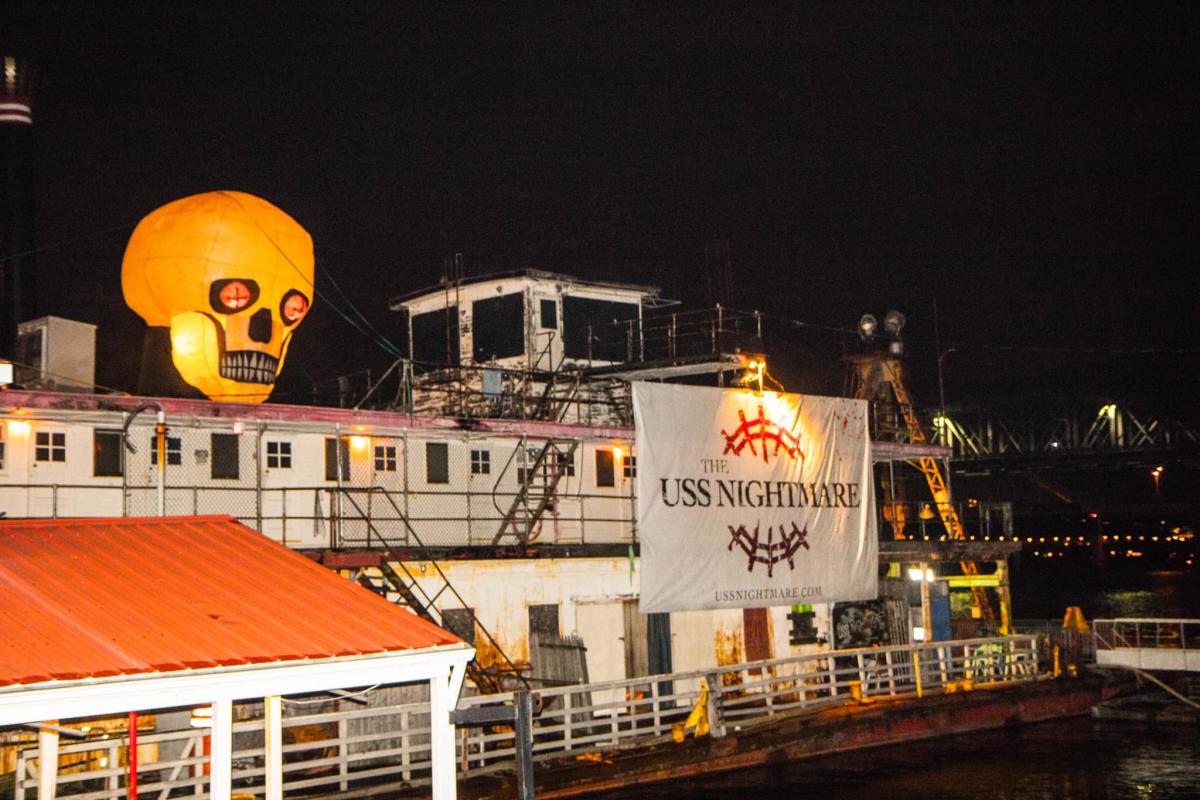 Image is of the USS Nightmare from the side with a big sign that say's "USS Nightmare".
