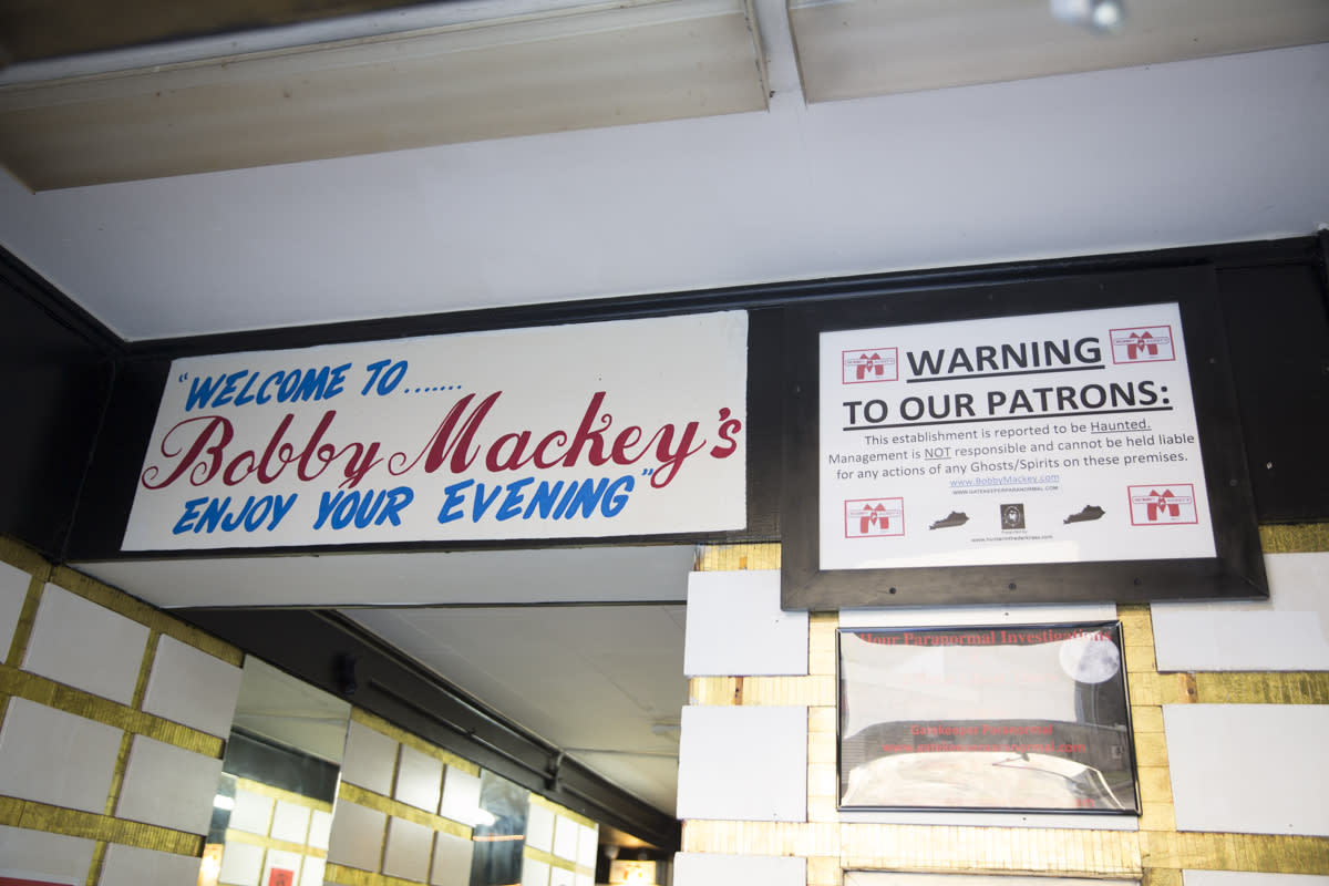 Image is of a sign inside Bobby Mackey's that warn guests of ghosts.