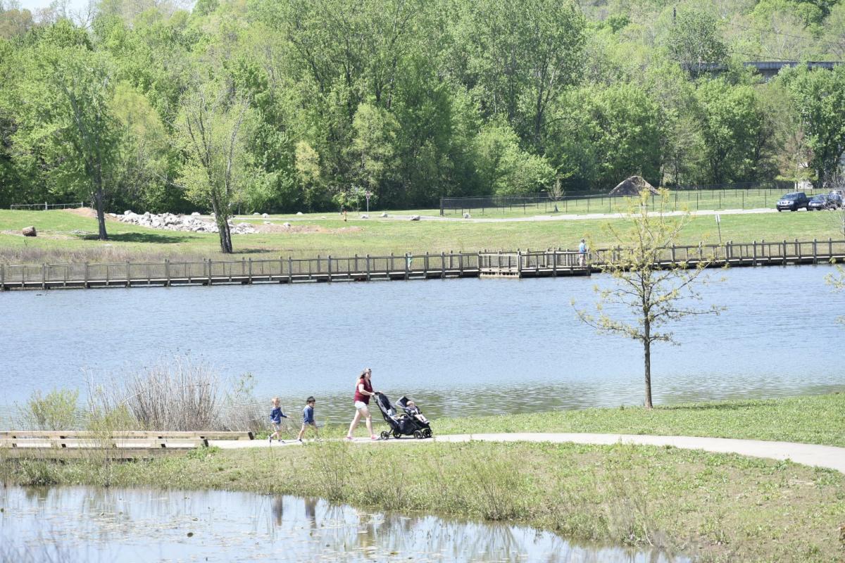 Woman pushes stroller in Liberty Park