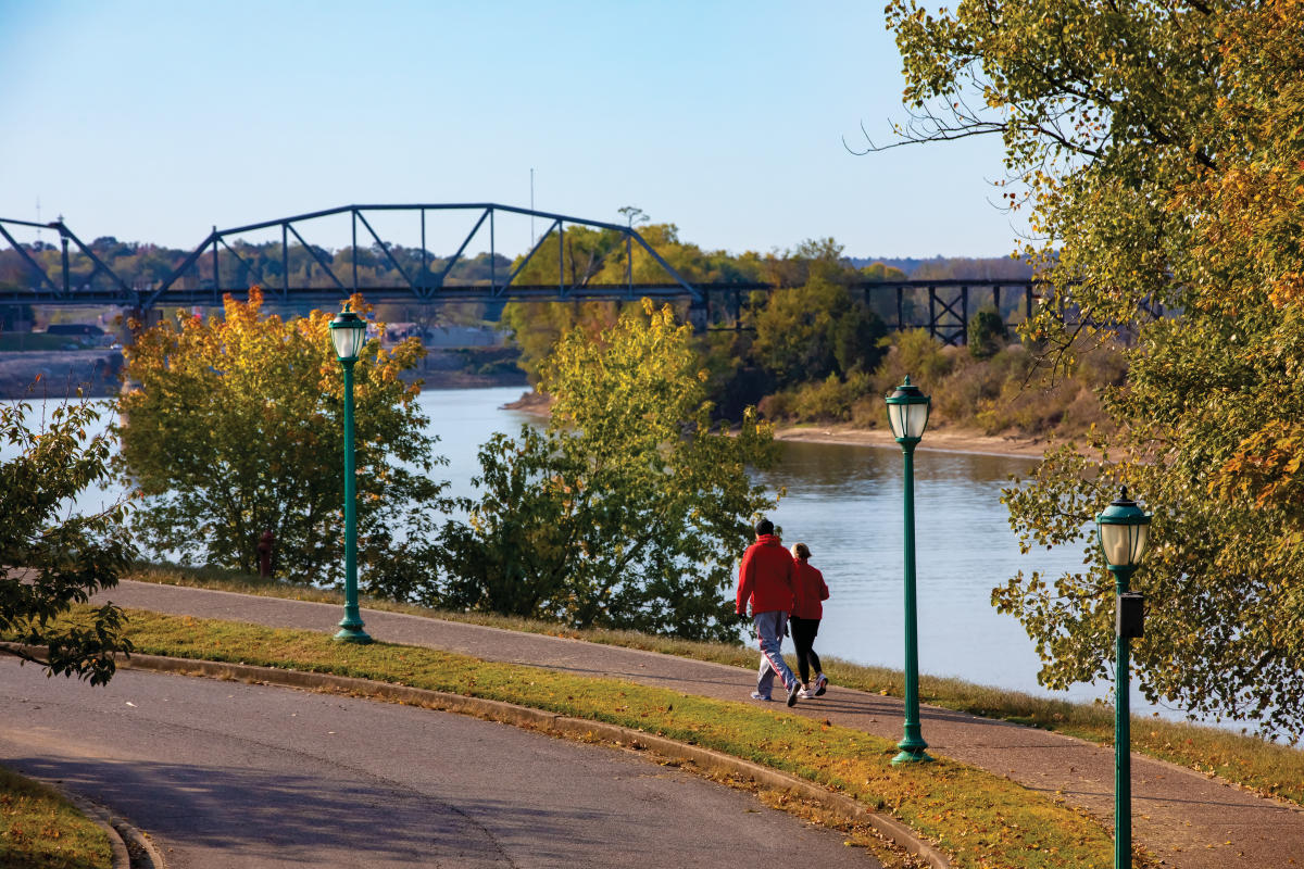 couple walking along the river