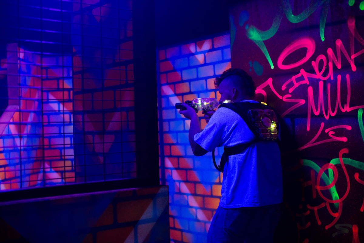 boy playing indoor laser tag