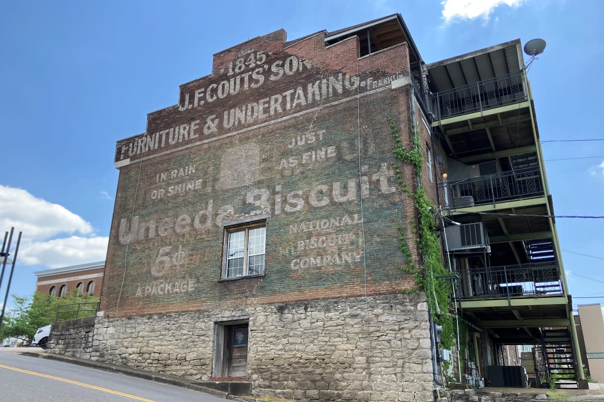 The Uneeda Biscuit wall sign on the side of the Poston Building on Public Square, seen from Main Street, in Clarksville on April 24, 2023.