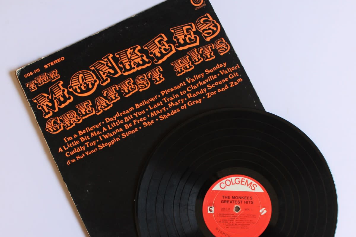A copy of The Monkees Greatest Hits, which of course includes their debut single “Last Train to Clarksville.”