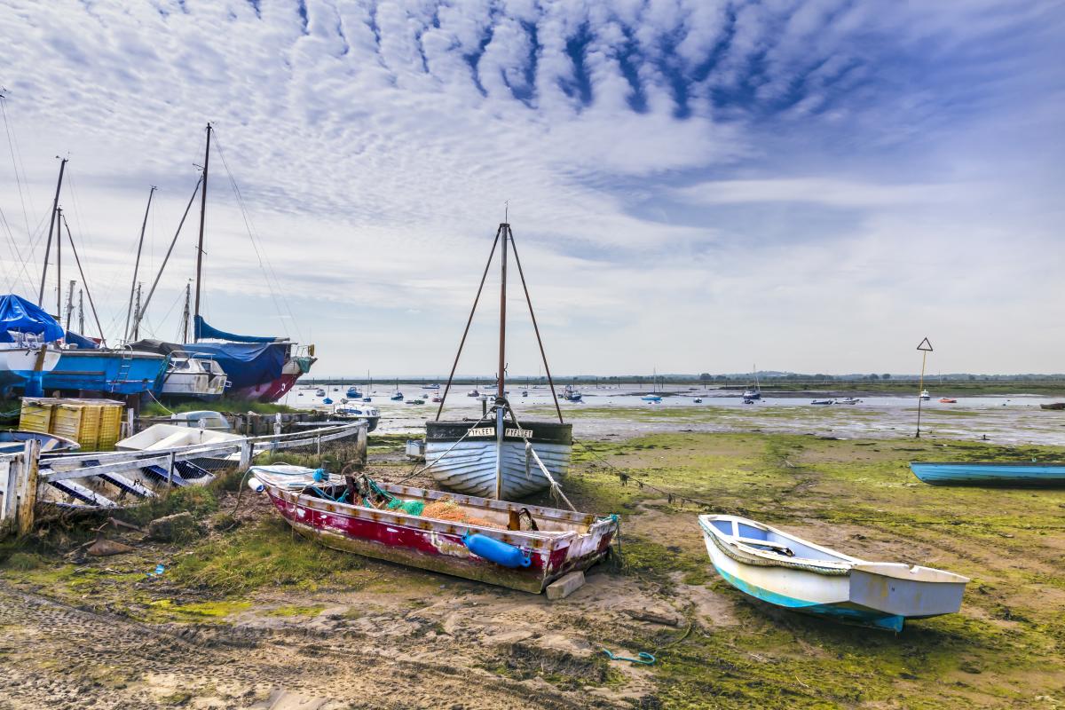 Boats on the beach at Mersea Island when the tide is out