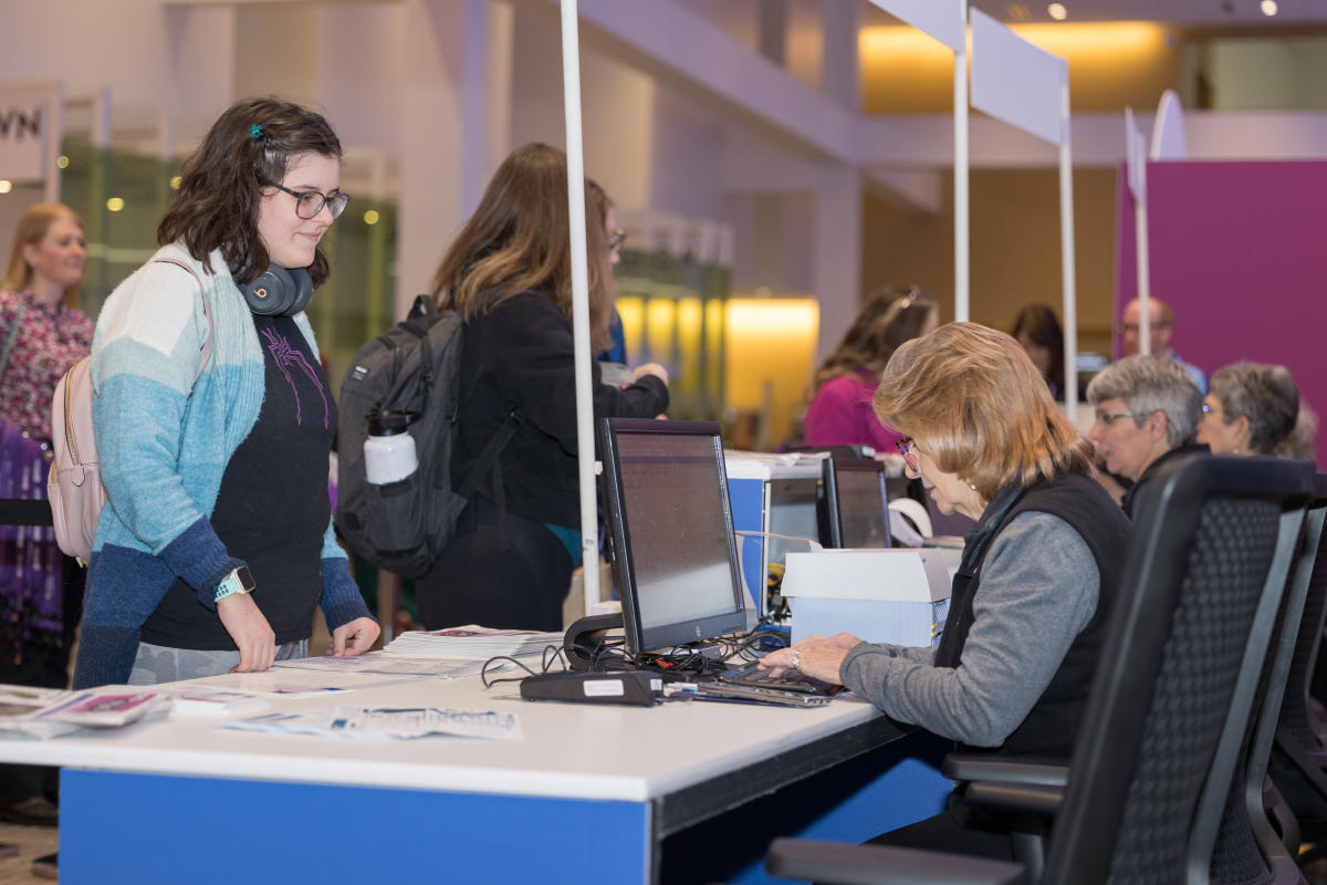 Destination Specialists helping convention attendees with registration at Greater Columbus Convention Center