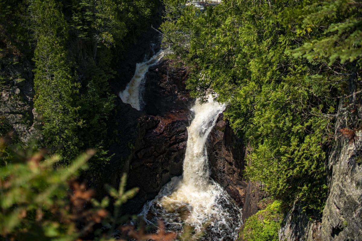 A waterfall flowing in the summertime
