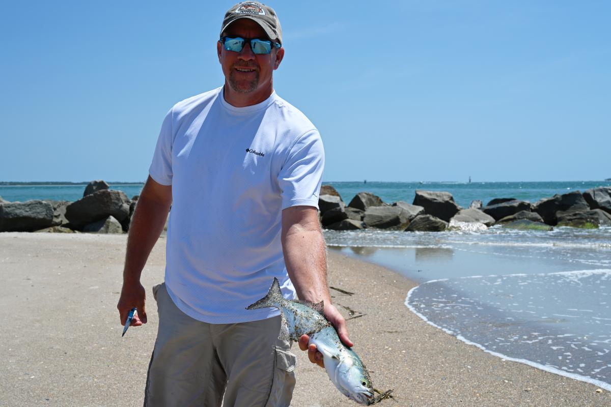 Fisherman with a Bluefish