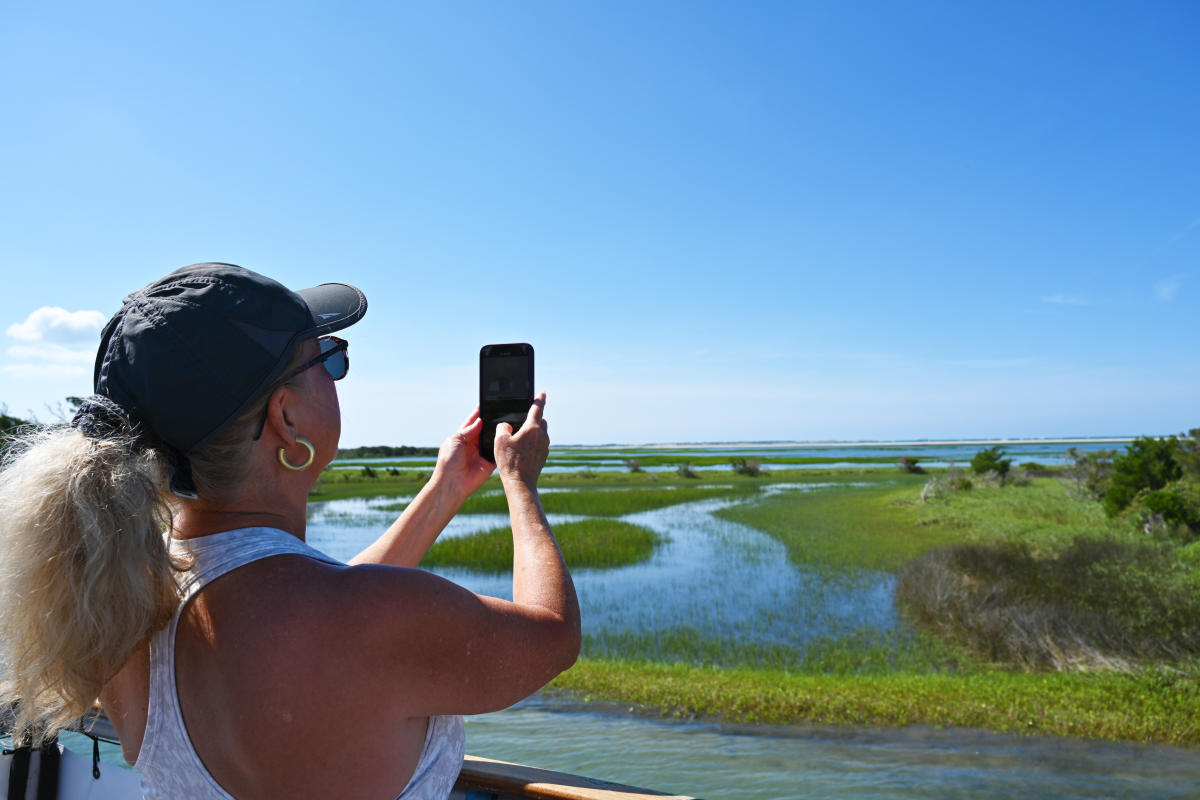 Lady Taking Photo on Boat Tour