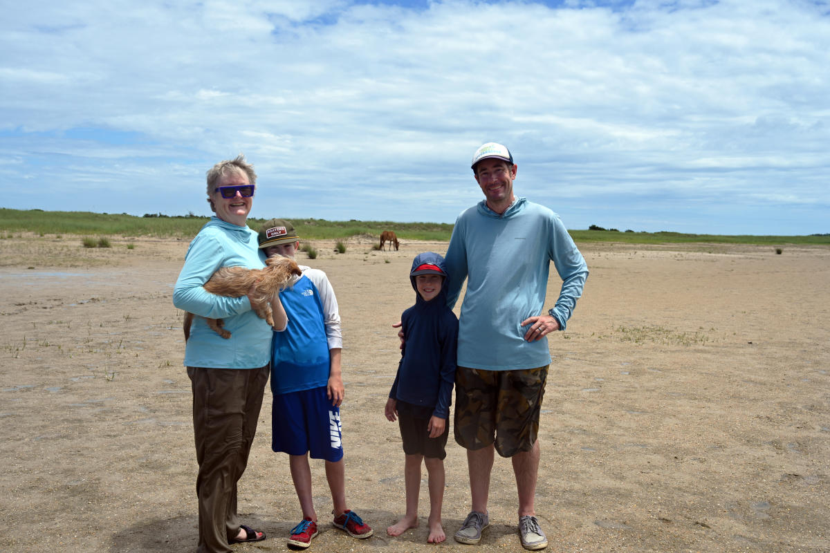 Family with Wild Horse in the Background