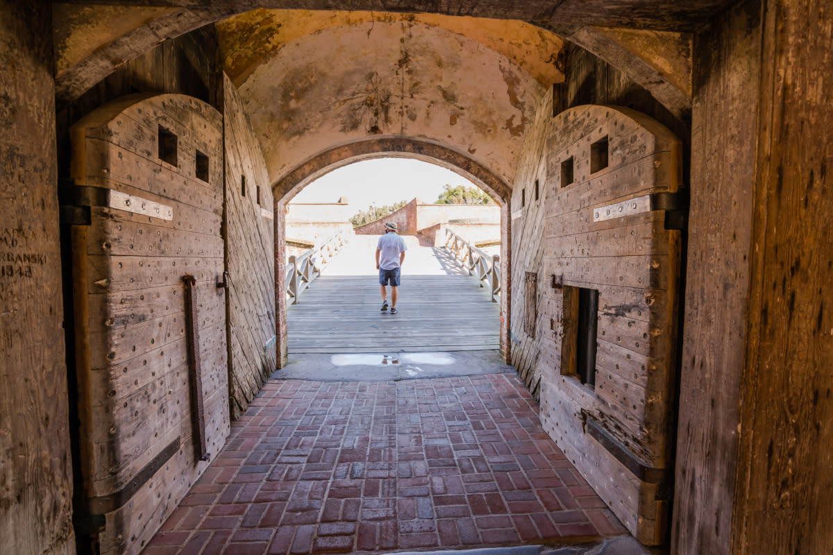 A visitor explores the history of Fort Macon State Park.