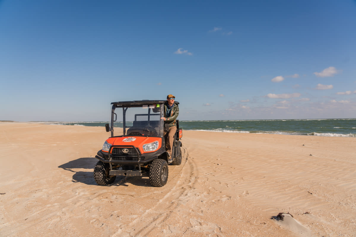 A visitor surveys the Cape Lookout National Seashore from a rental Kubota ATV.