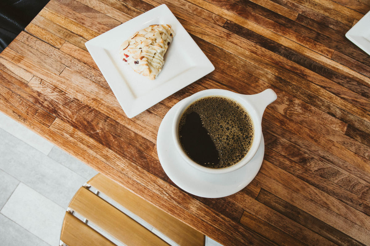 Cup of coffee and a pastry at Denim Coffee in PA