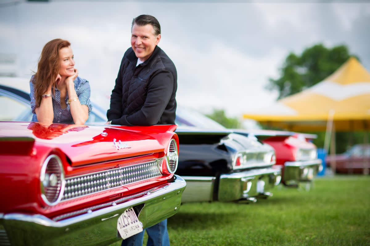 Enthusiasts enjoy the sights at a Carlisle classic car show.