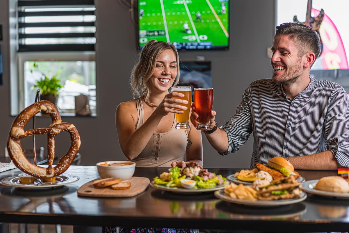 Couple toasting beer at Desperate Times