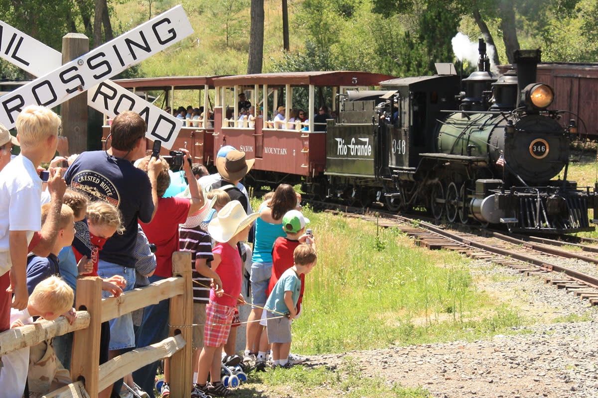 Train on a track before crowd at Colorado Railroad Museum