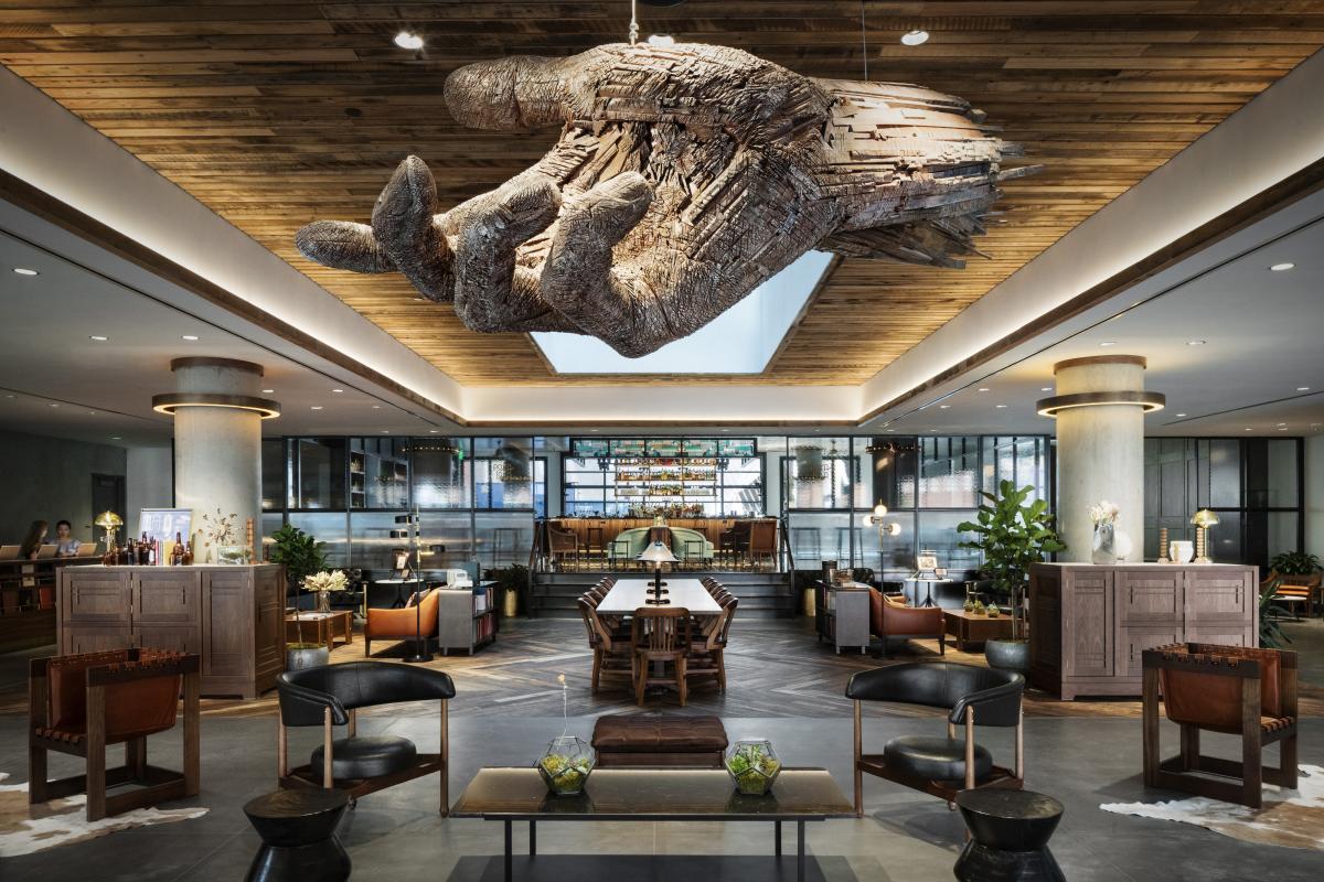 Carved wooden hand sculpture at The Maven hotel