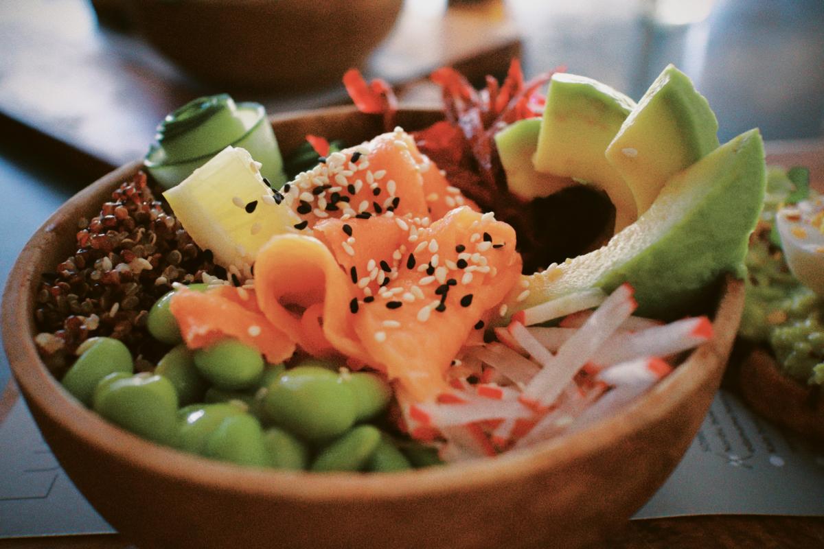 Poke bowl with avocado, edamame, fish, and other ingredients