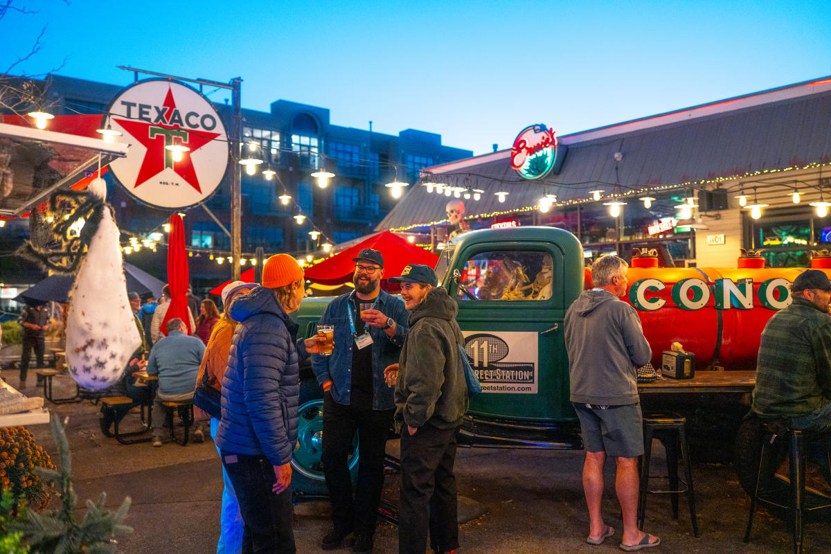 People talking at 11th Street Station in the evening.