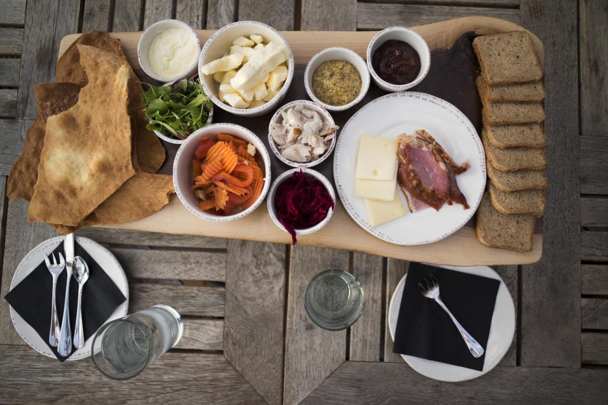 A charcuterie board served on the Lakely Patio