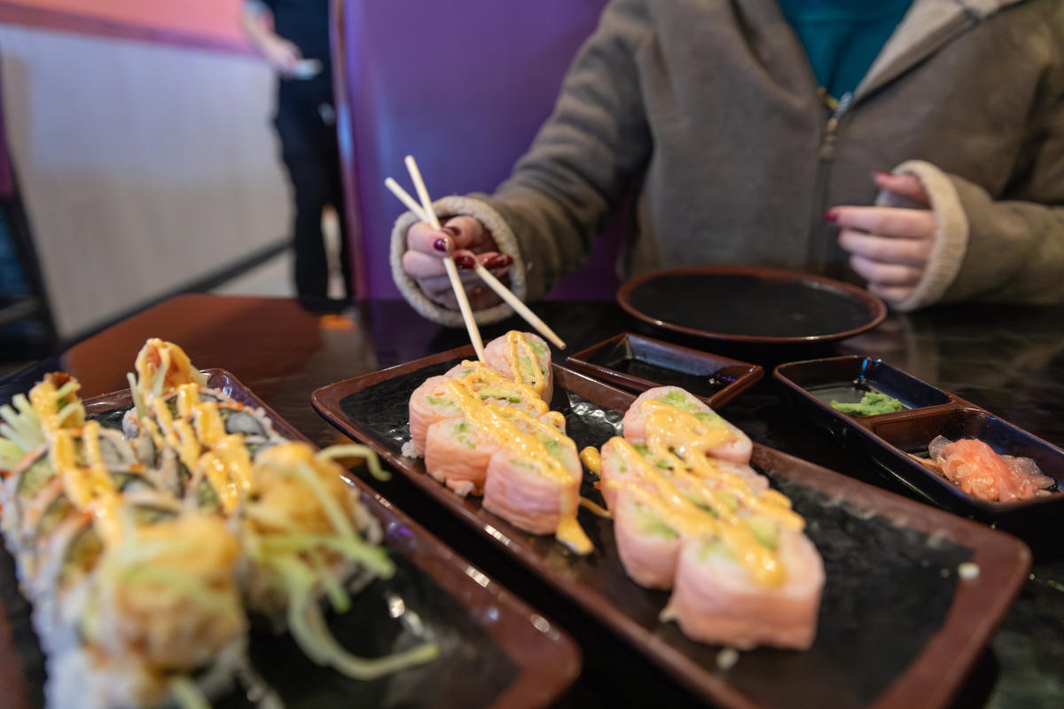 a plate full of colorful sushi rolls as Akame Sushi in Eau Claire