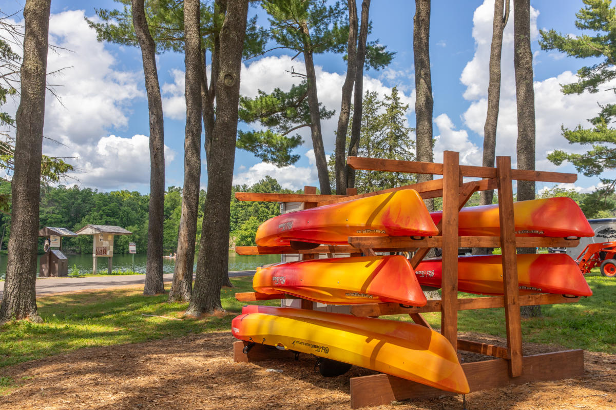 A rack of kayaks available for rent at Braun's Bay in Carson Park