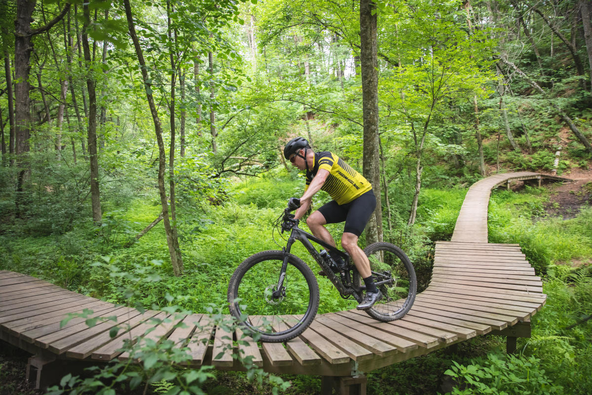 A mountain biker riding through Lowes Creek County Park