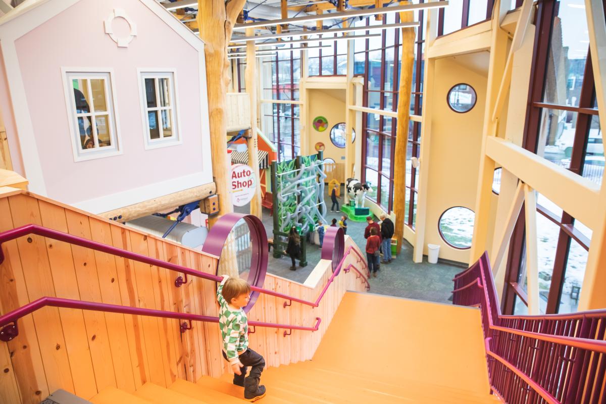 A young boy descending the stairs at the newly rennovated Children's Museum of Eau Claire