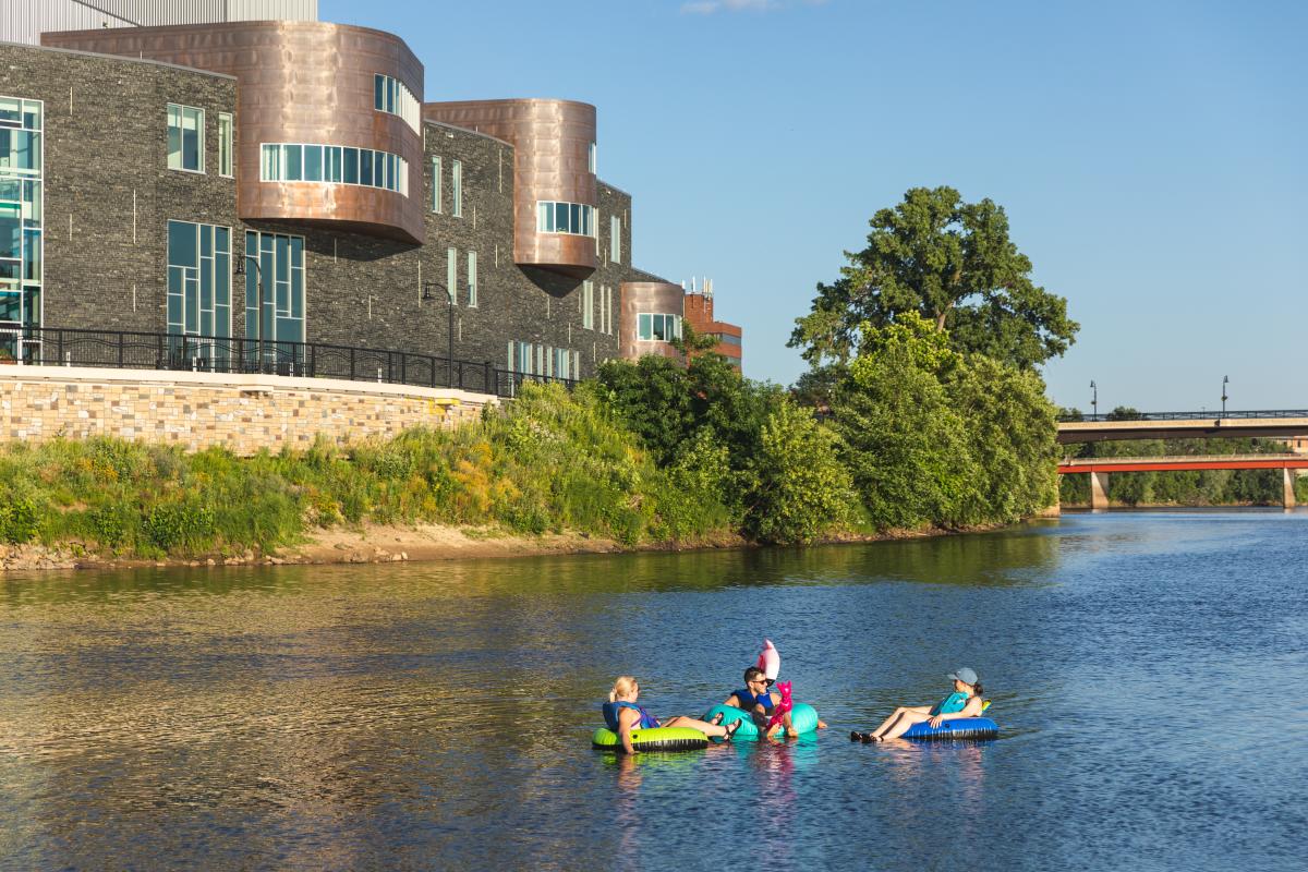 A group of three tubing at the confluence of the Chippewa and Eau Claire Rivers