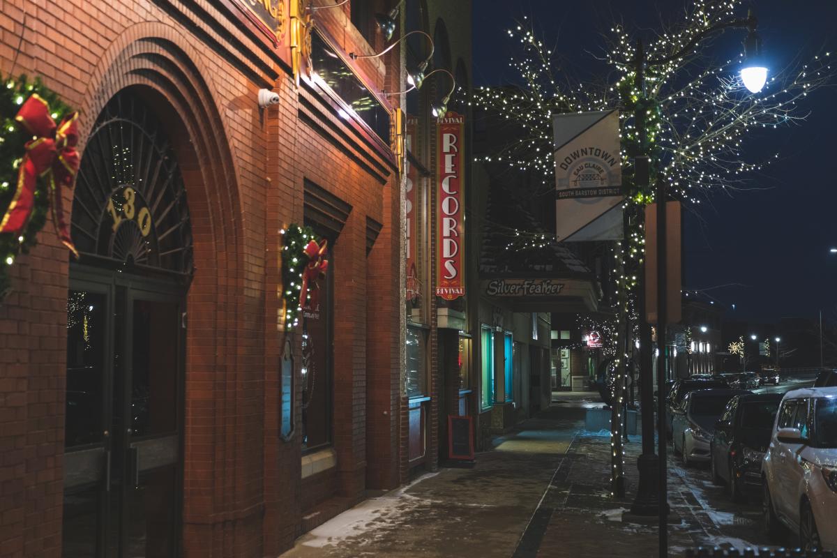 Barstow St. in downtown Eau Claire lit up at night in the winter during the holiday season