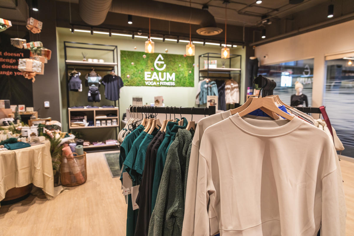 a photo inside Eaum Yoga showing clothing and accessories available for purchase
