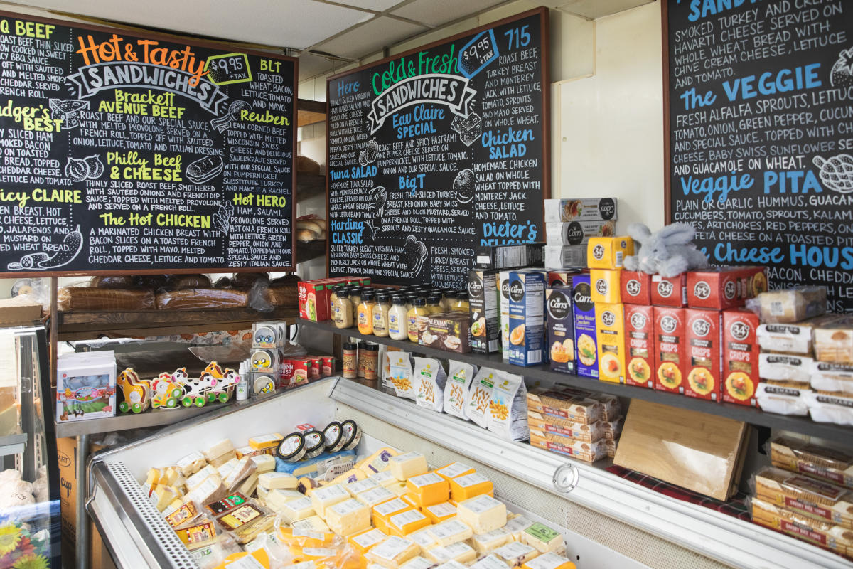 Cheese and menu boards at Eau Claire Cheese and Deli